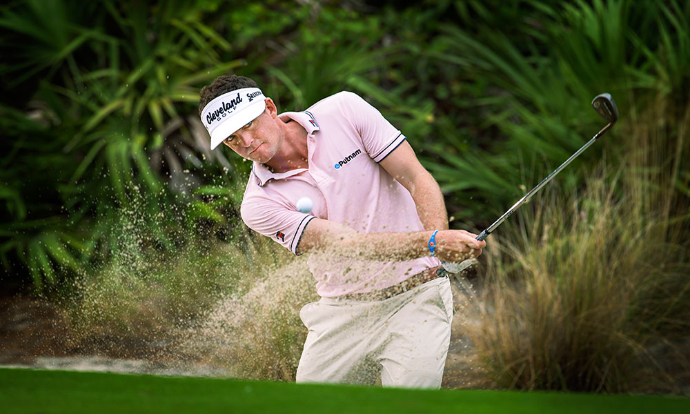Keegan Bradley hits it out of a sand trap