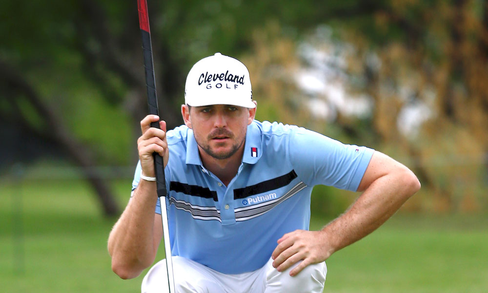 Keegan Bradley hits it out of a sand trap
